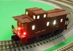 Lionel Lines 6037 Brown Caboose Scale Rail With Led Lighting. Fixed Price $55.00.