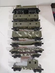 Lionel Gauge Model Railroad Army NW2 Diesel Switcher & Freight Cars. Fixed Price $120.00.