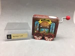 Berliner Luft Song Crank Music Box Wagon Made Germany Souvenir 2 1/8". Fixed Price $22.39.