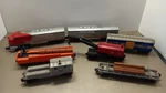 Lionel 2243 Santa Fe Diesel F-3 Locomotive, Barrel & Lumber Car, 7 Piece Set. Fixed Price $374.98.
