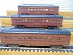 Three Lionel 6-16000, 31, 94 Pennsylvania Passenger Cars Lighted C1987-88. Fixed Price $89.99.